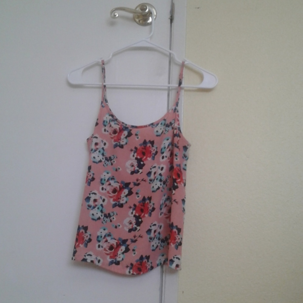 Pink spaghetti-strap loose fitting floral top.